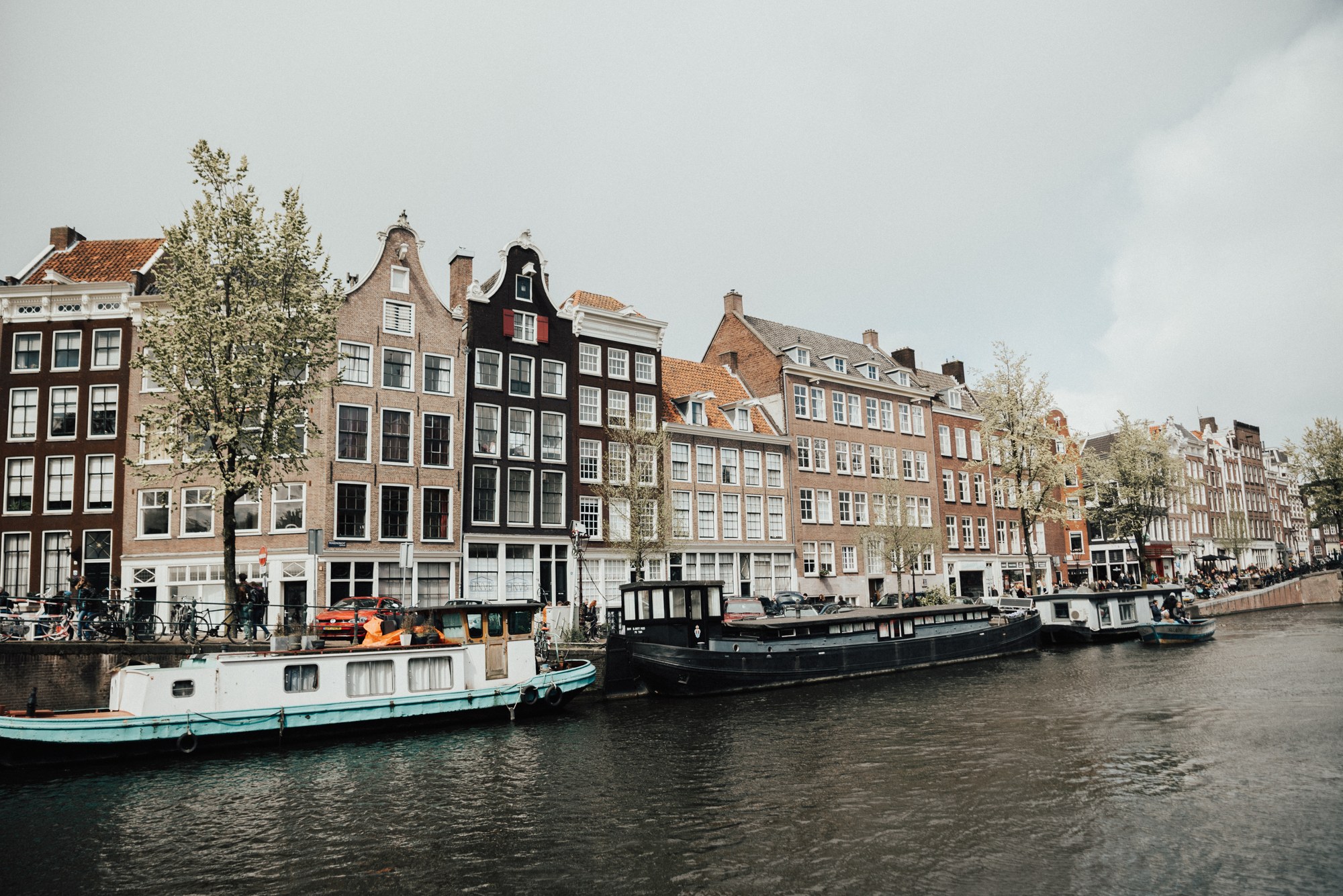 Canal houses reflected in the water in Amsterdam, Netherlands