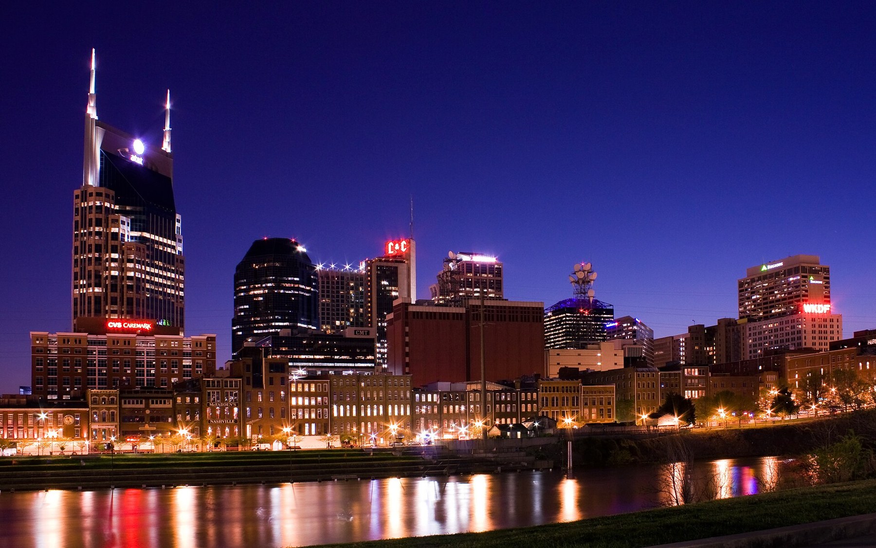 Nashville skyline illuminated at night along the Cumberland River